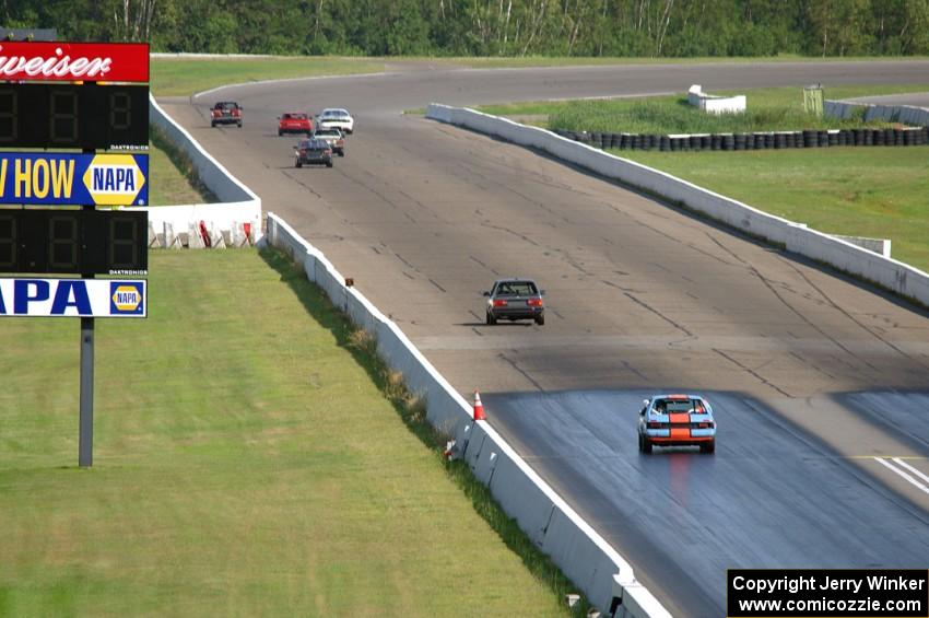 The Most Interesting Chumps In The World BMW 325i and Bromance Racing Ford Mustang chase a group of cars down the front straight