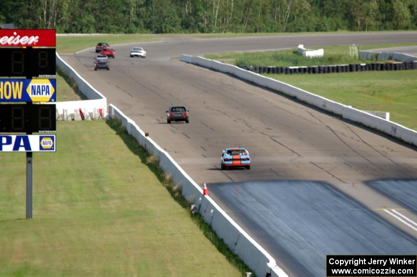 The Most Interesting Chumps In The World BMW 325i and Bromance Racing Ford Mustang chase a group of cars down the front straight