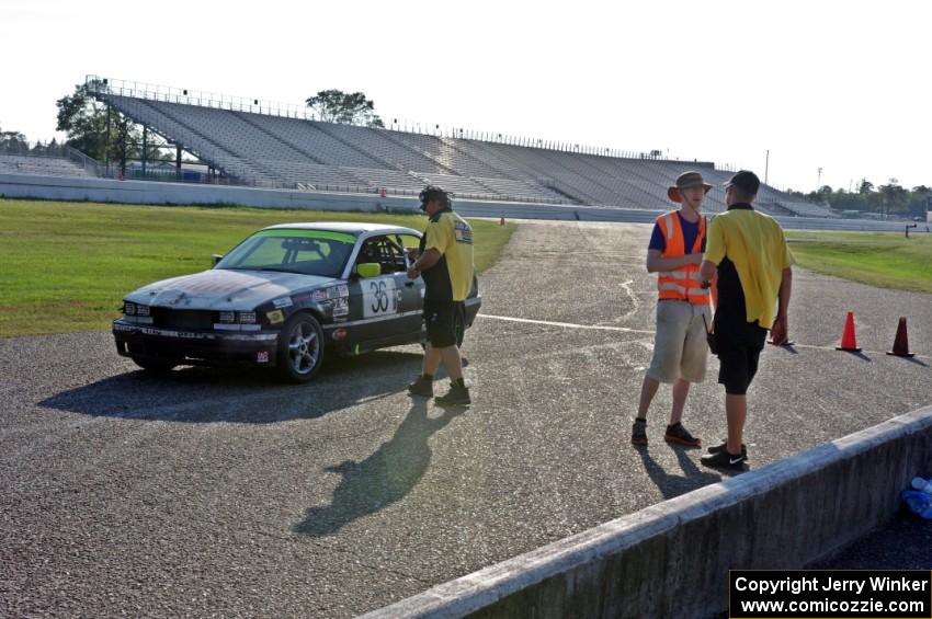 Ambitious But Rubbish Racing BMW 325 in the pits.