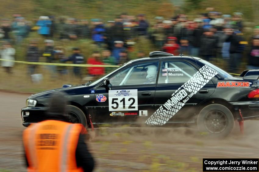 Corey Holmes / Dustin Masters Subaru Impreza comes through the SS1 (Green Acres I) spectator area.