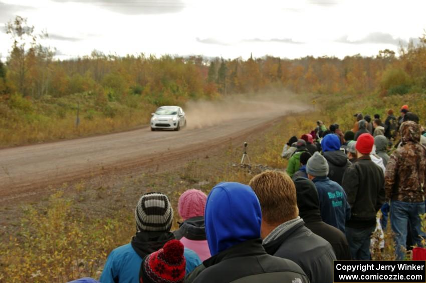 Justin Kollien / Daniel Garant Ford Fiesta R1 comes through the SS1 (Green Acres I) spectator area.