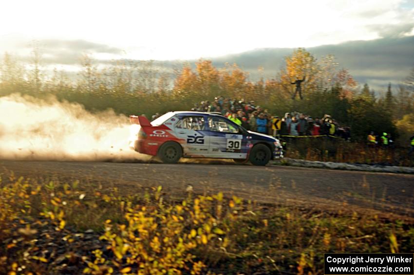 George Plsek / Nathalie Richard Mitsubishi Lancer Evo IX comes through the SS15 (Green Acres II) spectator area.