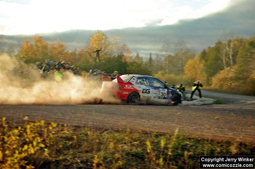 George Plsek / Nathalie Richard Mitsubishi Lancer Evo IX comes through the SS15 (Green Acres II) spectator area.