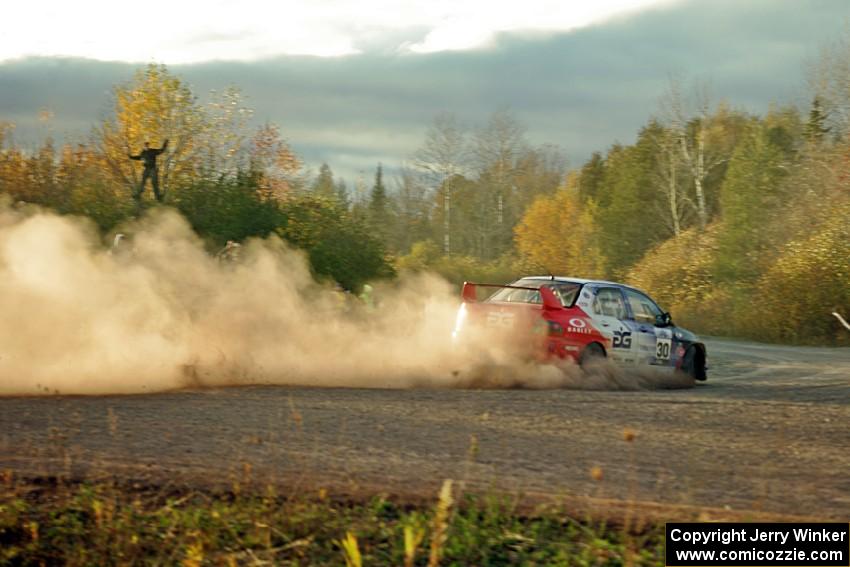 George Plsek / Nathalie Richard Mitsubishi Lancer Evo IX comes through the SS15 (Green Acres II) spectator area.