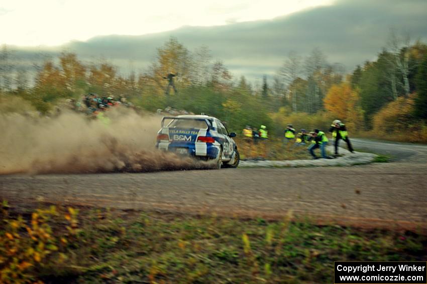 Piotr Fetela / John Hall Subaru Impreza STi comes through the SS15 (Green Acres II) spectator area.