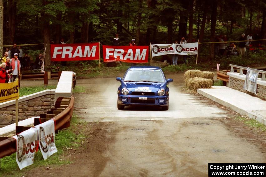 Karl Scheible / Brian Maxwell Subaru WRX STi comes through the spectator area at Phasa, SS4.