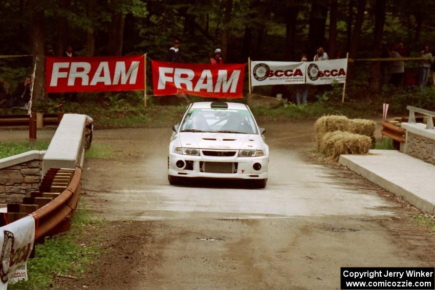 Seamus Burke / Frank Cunningham Mitsubishi Lancer Evo VI comes through the spectator area at Phasa, SS4.