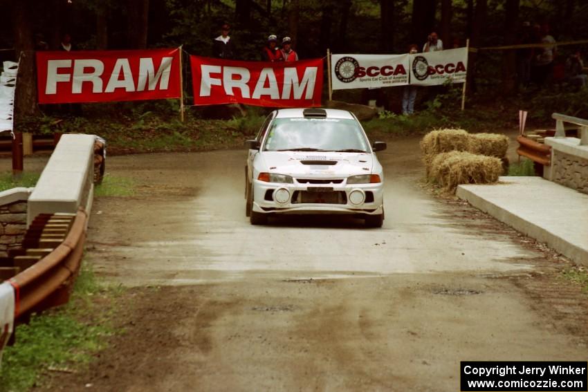 Tom Lawless / Brian Sharkey Mitubishi Lancer Evo IV comes through the spectator area at Phasa, SS4.