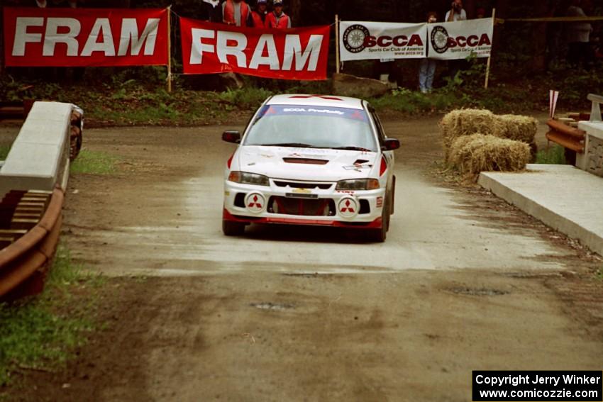 Vinnie Frontinan / Luis Teixeira Mitsubishi Lancer Evo IV comes through the spectator area at Phasa, SS4.