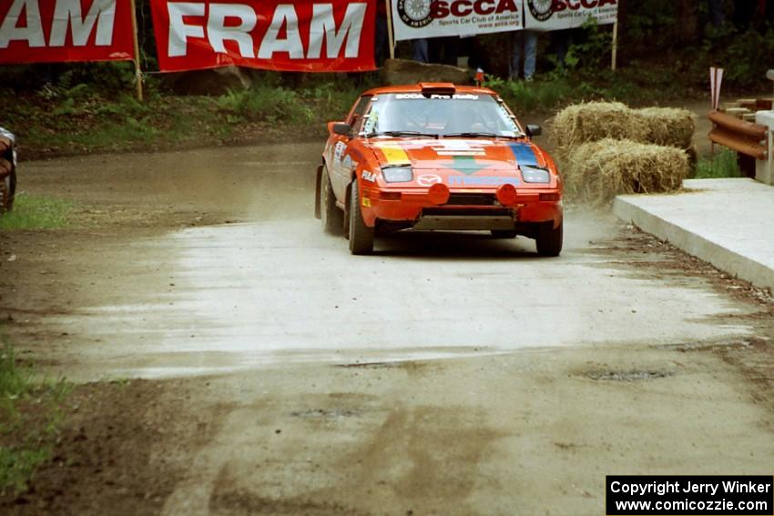 Andrew Havas / Scott Slingerland Mazda RX-7 comes through the spectator area at Phasa, SS4.