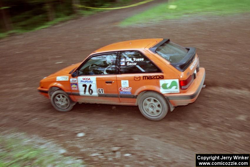 Gail Truess / Jeff Secor Mazda 323GTX at the first hairpin on Colton Stock, SS5.