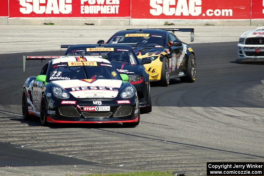 Jack Baldwin's Porsche Cayman, Michael Cooper's Chevy Camaro Z28 and Lou Gigliotti's Aston Martin Vantage GT4