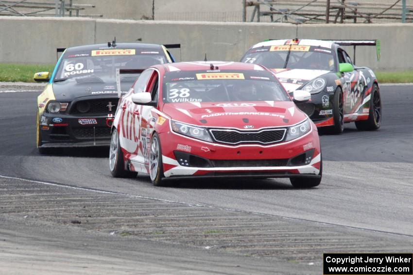 Mark Wilkins' Kia Optima, Jack Roush, Jr.'s Ford Mustang Boss 302 and Jack Baldwin's Porsche Cayman