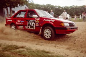 Adam Vale da Serra / Christine Vale da Serra Mazda 323 GT at the finish of SS1, Mexico Rec.