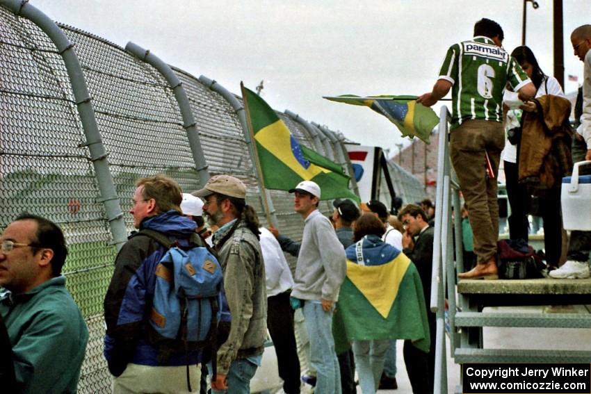 Brazilian fans near start/finish.