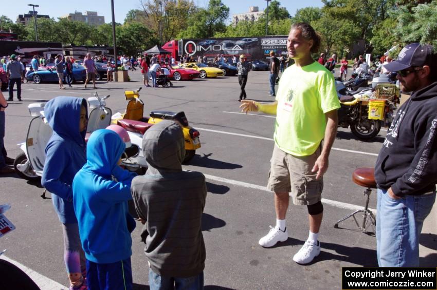 Rich Laybis chats to a group of kids about foregn cars.