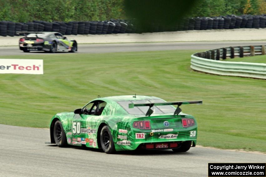 Bruce Nesbitt's Ford Mustang chases Steven Lustig's Ford Mustang