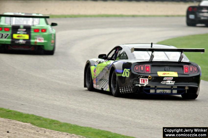 Steven Lustig's Ford Mustang chases Jordan Bernloehr's Chevy Camaro