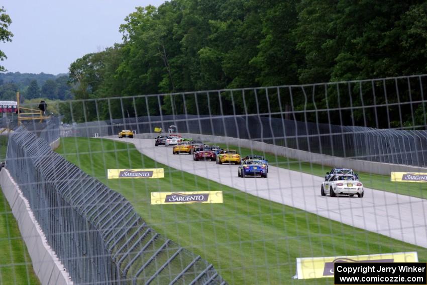 The first race ends under yellow condtions behind the pace car.