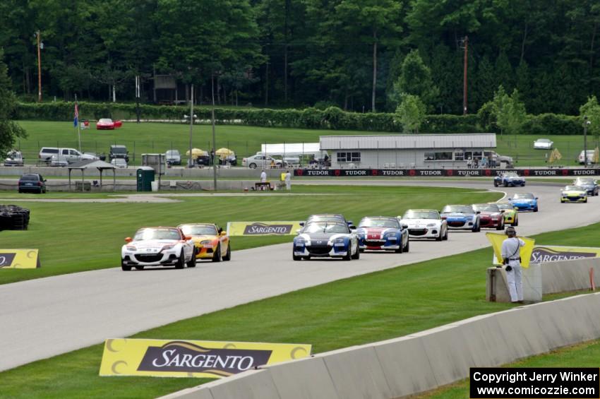 The first race ends under yellow condtions behind the pace car.