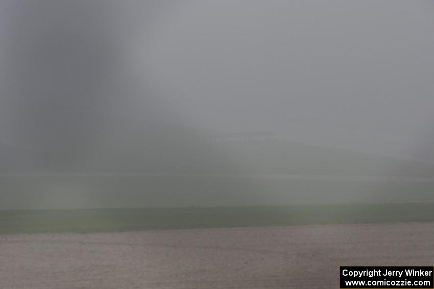 The second race starts under yellow flag conditions, behind the pace car, due to thick fog.