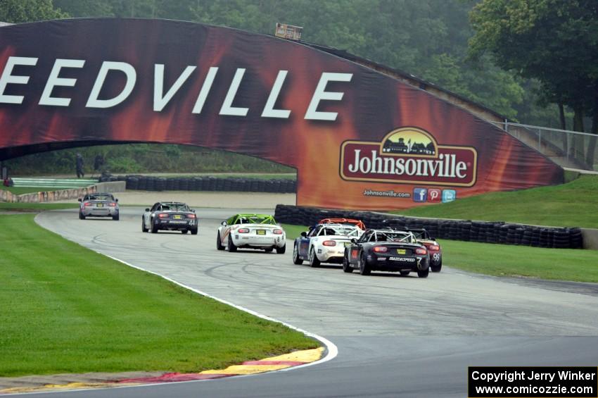 MX-5s head out of turn 8 into the carousel.