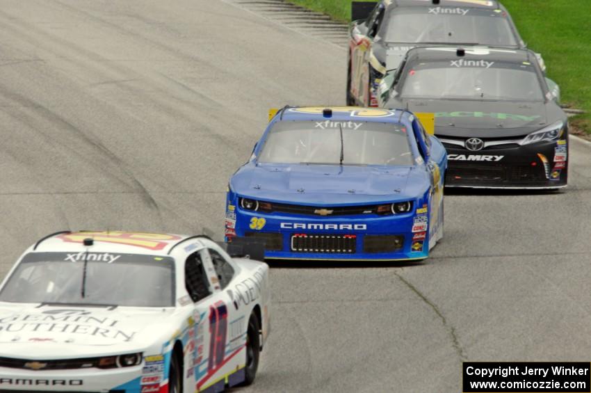 Kevin O'Connell's Chevy Camaro, Ryan Sieg's Chevy Camaro, David Starr's Toyota Camry and Stanton Barrett's Ford Mustang