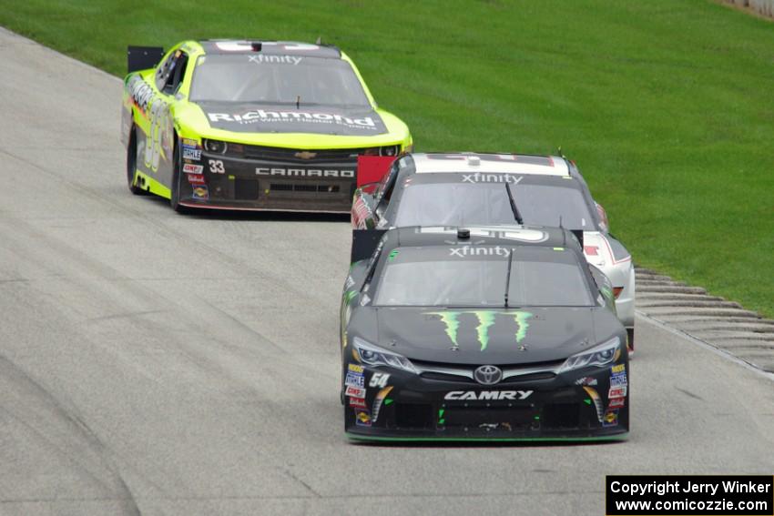 Boris Said III's Toyota Camry, Ryan Blaney's Ford Mustang and Paul Menard's Chevy Camaro