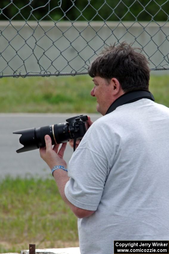 Stacy Scharch shoots from the hole in the turn 5 fence.