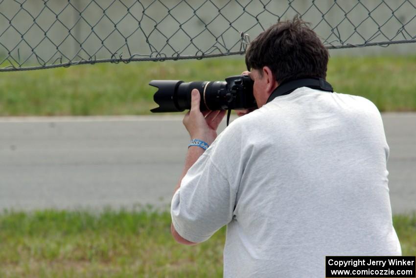 Stacy Scharch shoots from the hole in the turn 5 fence.