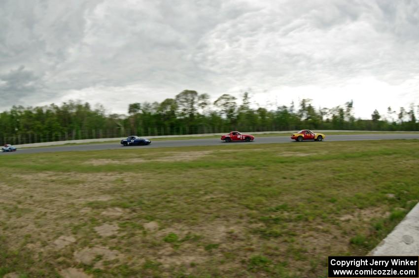 Greg Youngdahl's, Andrew Jenkins', Craig Silver's and Rick Buan's Spec Miata Mazda Miatas