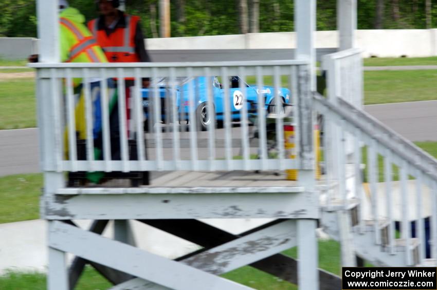 Brian Kennedy's Ford Mustang Boss 302 past the turn 1A flagstand.