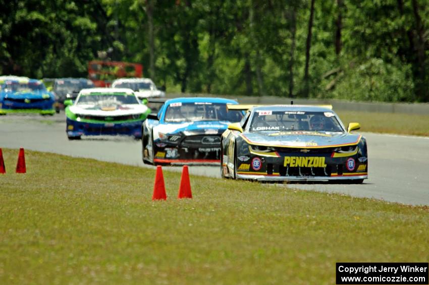 Lawrence Loshak's Chevy Camaro and Tony Buffomante's Ford Mustang lead the rest of the field.