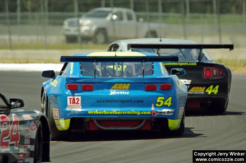 Adam Andretti's Ford Mustang and Tommy Archer's Chevy Camaro