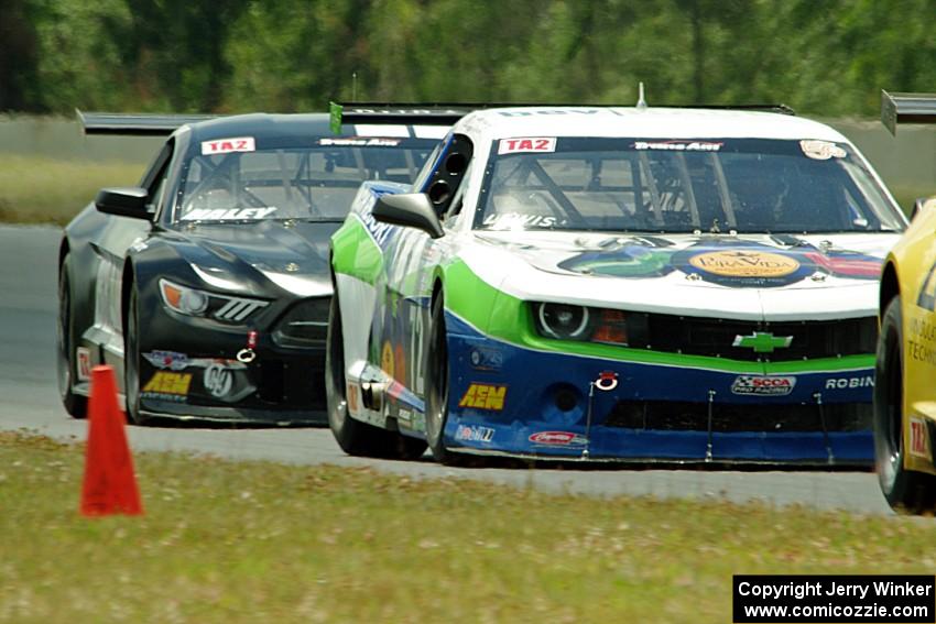 Shane Lewis' Chevy Camaro and Justin Haley's Ford Mustang