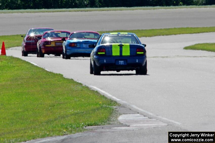 John Glowaski's STL Dodge Neon ACR chases Mike Smith's STL Honda Civic Si and Greg Youngdahl's and Rick Buan's Spec Miata Mazda 