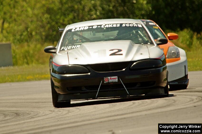 Tom Fuehrer's SPO Ford Mustang and James Berlin's T3 Nissan 350Z