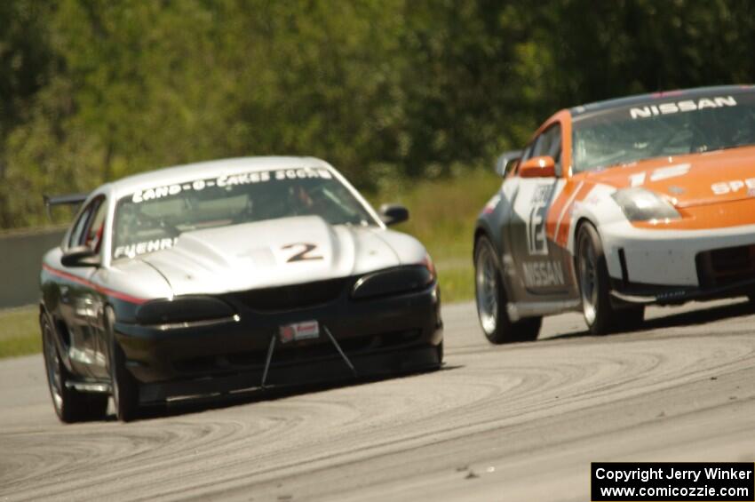 Tom Fuehrer's SPO Ford Mustang and James Berlin's T3 Nissan 350Z