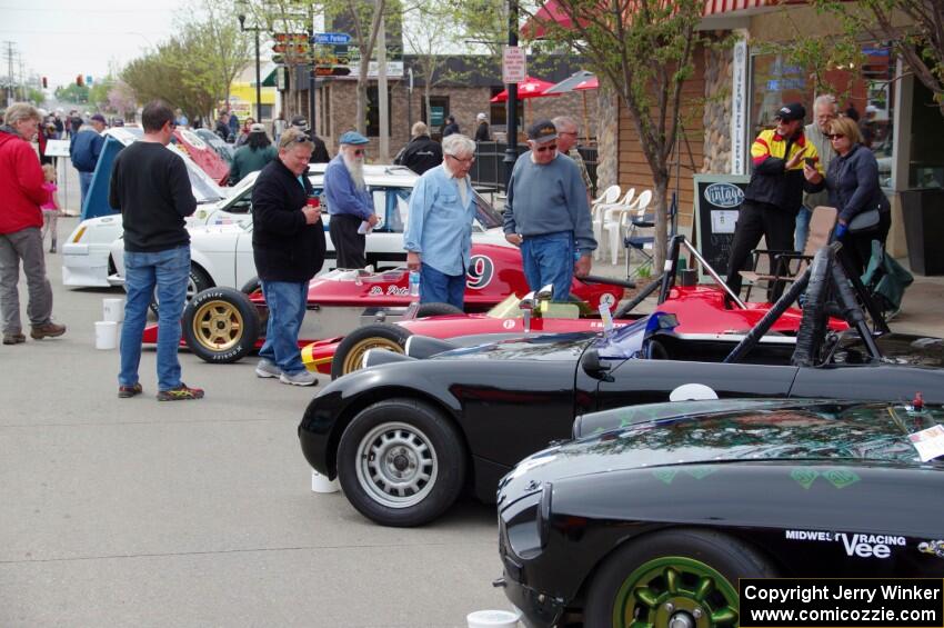 Vintage racing cars lined up on the streets of Osseo.