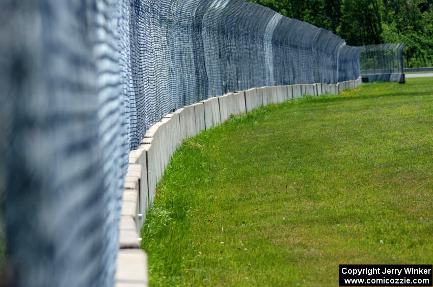 Catch-fencing and barriers between turns five and six.