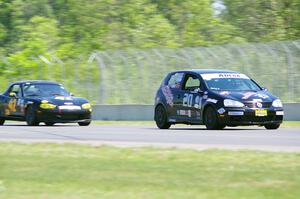 Tom Daly's STU VW Rabbit and Greg Youngdahl's Spec Miata Mazda Miata