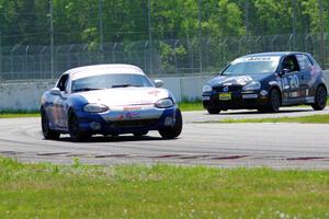 Philip Heald's Spec Miata Mazda Miata and Tom Daly's T4 VW Rabbit