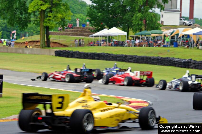 Félix Serrallés gets into the back of Ed Jones as Santiago Urrutia gets past for the lead exiting turn 6. All cars are Dallara I