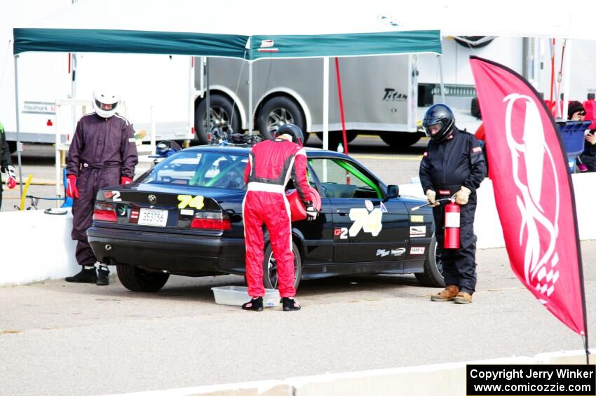 Noobman Racing BMW 325is in the pits.