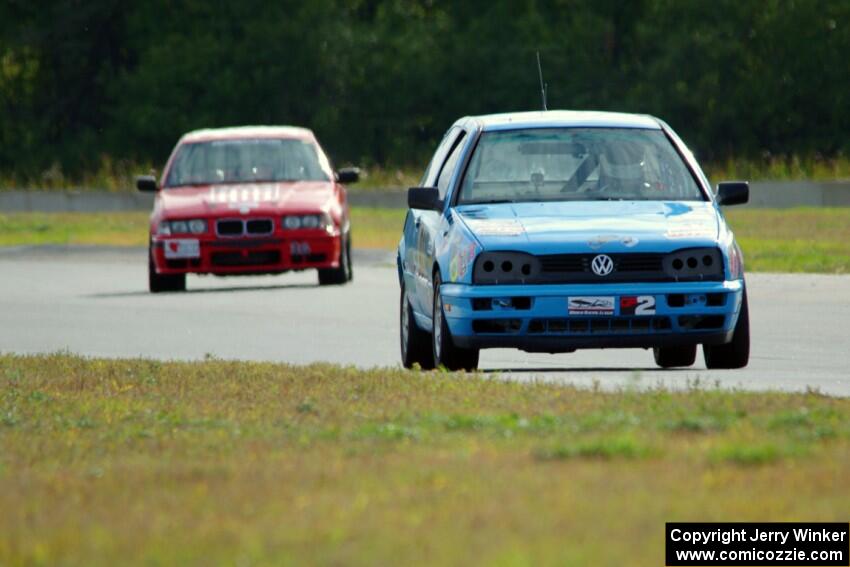 Blue Sky Racing VW Golf and Ambitious But Rubbish Racing BMW 325