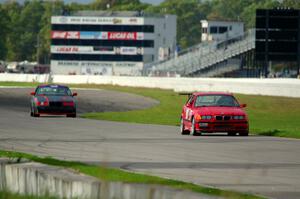 In the Red 1 BMW M3 and North Loop Motorsports BMW 323is