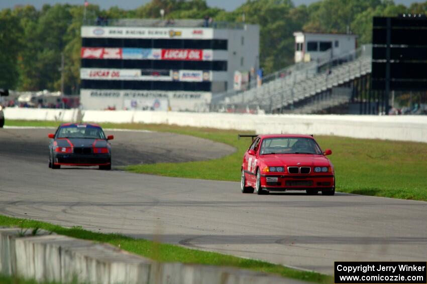 In the Red 1 BMW M3 and North Loop Motorsports BMW 323is