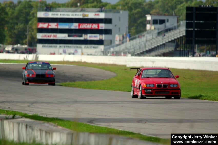 In the Red 1 BMW M3 and North Loop Motorsports BMW 323is