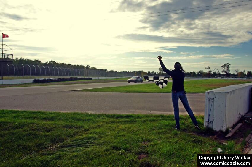 North Loop Motorsports BMW 323is takes the checkered flag.