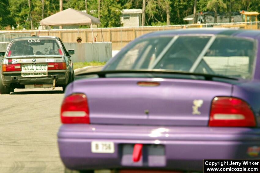 Chump Faces BMW 325is and Plum Crazy Plymouth Neon